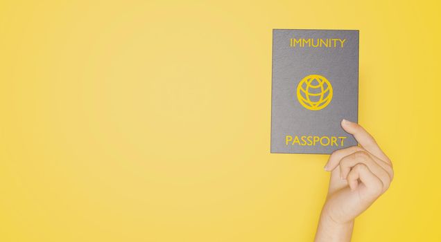 coronavirus immunity passport banner held by a hand on yellow background. 3d rendering