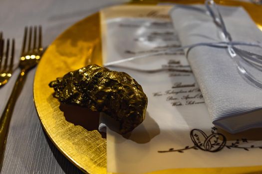 White green and golden decorations on wedding table at outdoor wedding