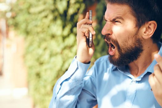 business man with telephone communicating on the street. High quality photo