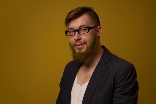 bearded man in a black jacket with a book in his hands education. High quality photo