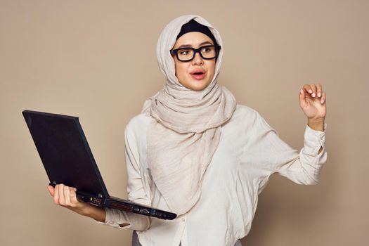 muslim woman with laptop work learning technology. High quality photo