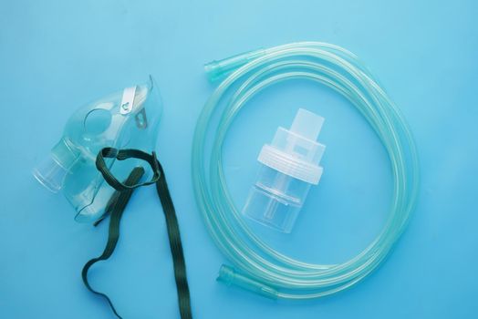 child nebulizer on blue background top view .