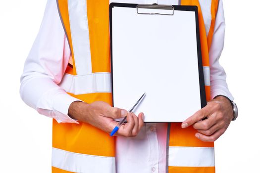 working man in orange uniform posing construction. High quality photo