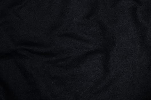 Black fabric textured as background.