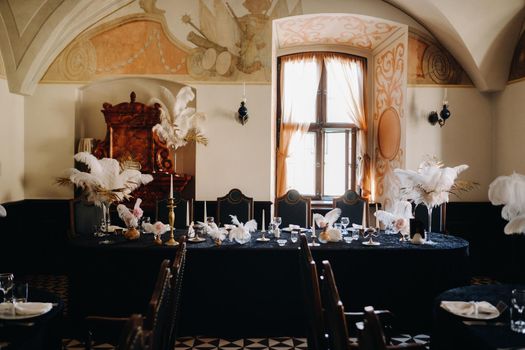 decorated festive table for a wedding evening in an old castle.