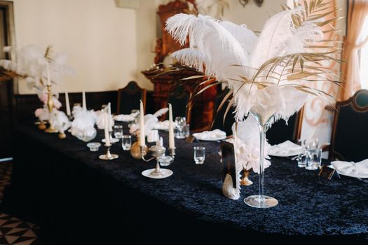 decorated festive table for a wedding evening in an old castle.