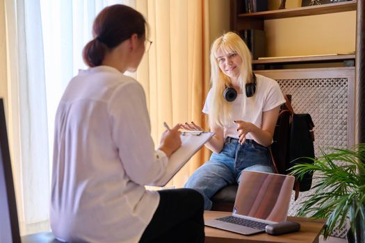 Session of female psychologist and girl teenage student in doctor's office. Consultation, professional assistance of therapist counselor for children and adolescents. Psychology, therapy psychotherapy