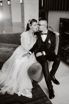 Stylish wedding couple in the interior. Glamorous bride and groom.black and white photo.