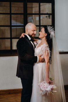 Elegant wedding couple in the interior of the old castle in the city of Nesvizh.