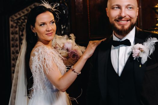 Elegant wedding couple in the interior of the old castle in the city of Nesvizh.