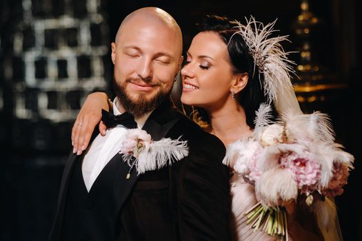 Elegant wedding couple in the interior of the old castle in the city of Nesvizh.