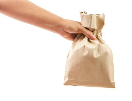 Hand holding paper bag isolated on white background, Save clipping path.