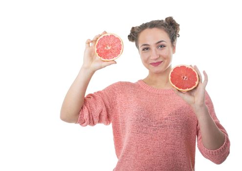 young girl with juicy and healthy grapefruits on white background