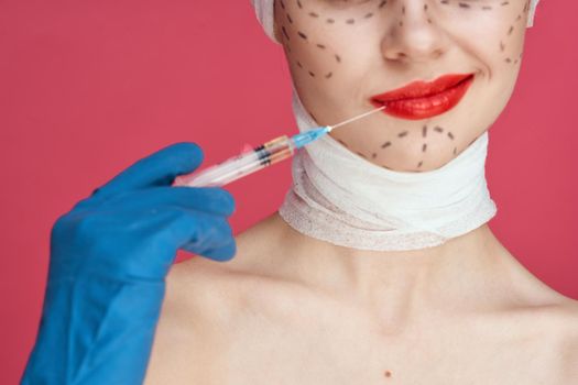 a person in blue gloves syringe in hands contour on the face lifting studio lifestyle. High quality photo