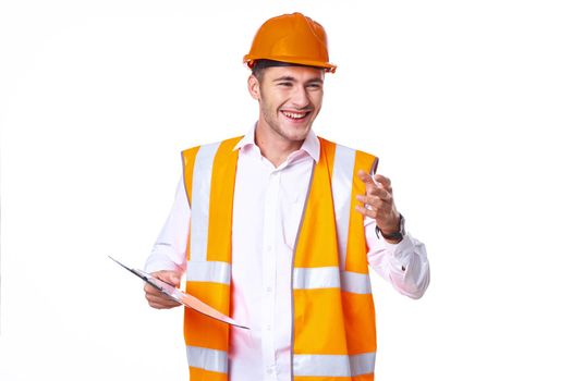 working man in orange uniform posing construction. High quality photo
