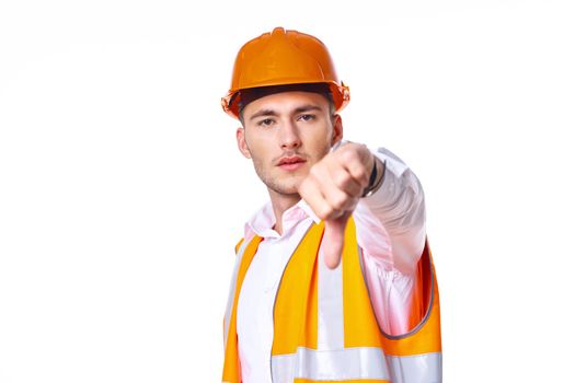 working man in orange uniform posing construction. High quality photo