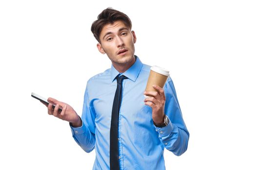 man in shirt with tie communication on the phone a cup of coffee official. High quality photo