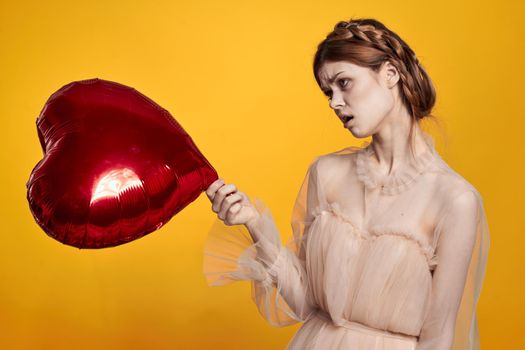 beautiful woman heart balloon holiday Valentine's Day model studio. High quality photo