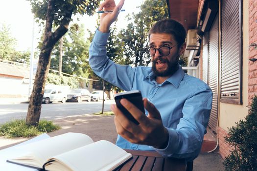 bearded man work documents technology manager in cafe. High quality photo