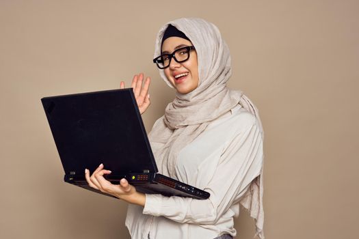 muslim woman with laptop work learning technology. High quality photo