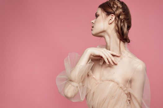 pretty woman hairstyle fun posing cosmetics fashion pink background. High quality photo