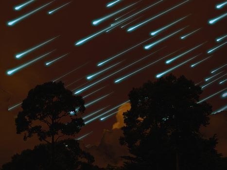 meteor on the night sky dark orange cloud and silhouette tree in tropic forest