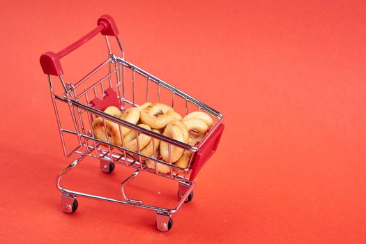 grocery cart red background supermarket isolated background. High quality photo