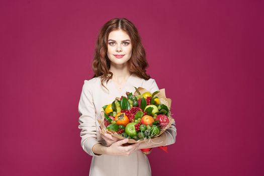 portrait of a woman smile posing fresh fruits bouquet emotions isolated background. High quality photo