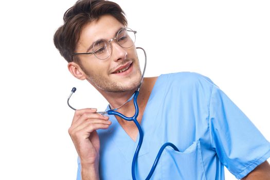 male doctor wearing glasses stethoscope posing light background. High quality photo