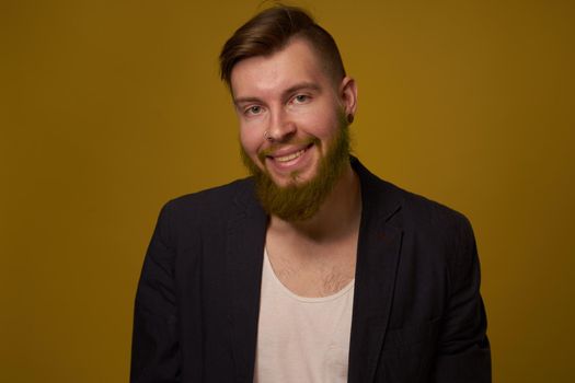 bearded man fashionable hairstyle jacket posing self confidence. High quality photo
