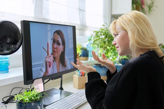 Online session of psychologist, counselor with female teenager. Teen student talking with social worker, behavior using video conferencing on computer. Mental health, adolescence, technology education