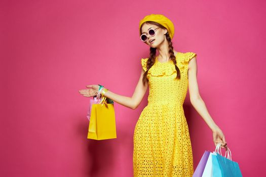 glamorous woman in a yellow hat Shopaholic fashion style isolated background. High quality photo