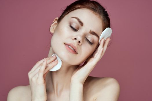 woman with cotton pads clean skin health hygiene. High quality photo