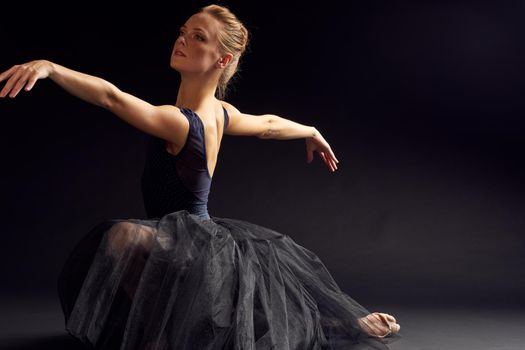 woman dancer in a black dress dance fashion exercise studio lifestyle. High quality photo