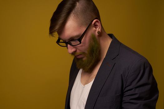 bearded man in a black jacket with a book in his hands education. High quality photo