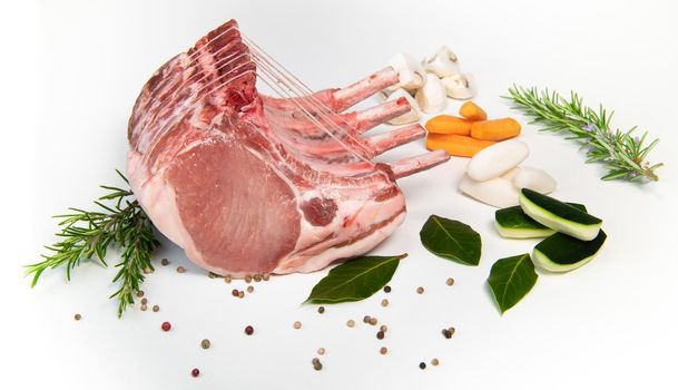 Pork ribs, Pork ribs with raw bone, Entrecote, Fresh and raw meats. Organic food, Meat with spices: pepper, salt, bay leaf, rosemary and its vegetables. High quality photo