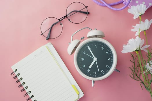 old alarm clock on color background