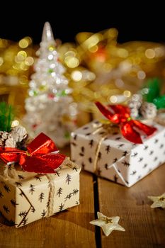 Christmas New Year's boxes with gifts. Yellow garland and decorative stars.