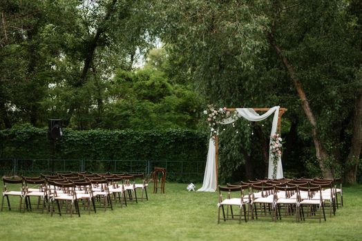 wedding ceremony area with dried flowers in a meadow in a pine brown forest