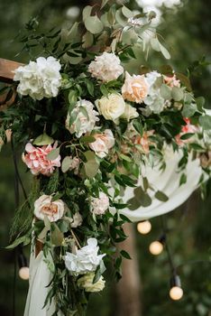 wedding ceremony area with dried flowers in a meadow in a pine brown forest