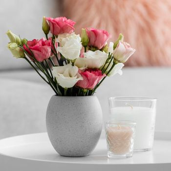 bouquet roses vase candles. High resolution photo