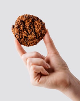 close up hand holding delicious cookies. High resolution photo