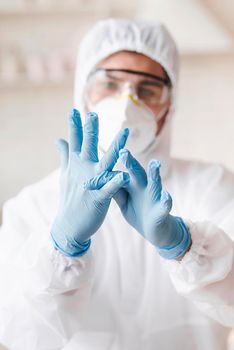 blurred man wearing protective gloves. High resolution photo