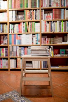 books lying ladder bookstore. High resolution photo