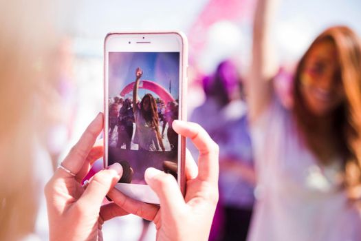 close up woman taking her friend mobile phone. High resolution photo