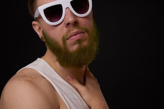 bearded macho man in white t-shirt sunglasses fashion tattoos. High quality photo