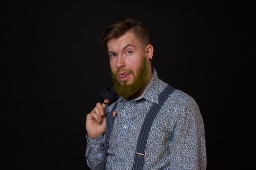 business man in shirt with jacket over his shoulders posing self confidence. High quality photo