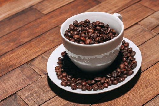 a cup of coffee Hot drink spilled grains view from above. High quality photo