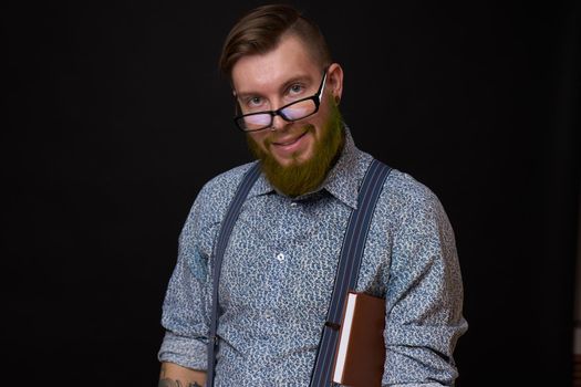 a business man in a shirt with a notebook in the hands of a manager. High quality photo