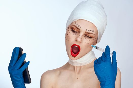 female patient in blue gloves syringe in hands contour on the face lifting studio lifestyle. High quality photo